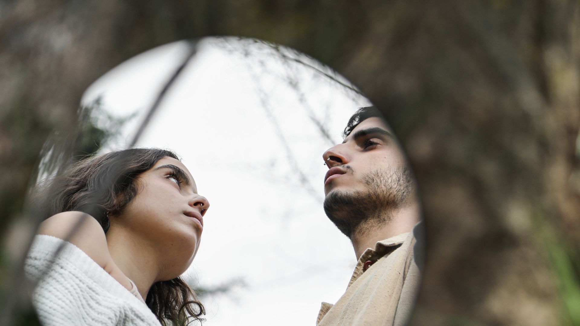 A Mirror Reflection of a Man and a Woman