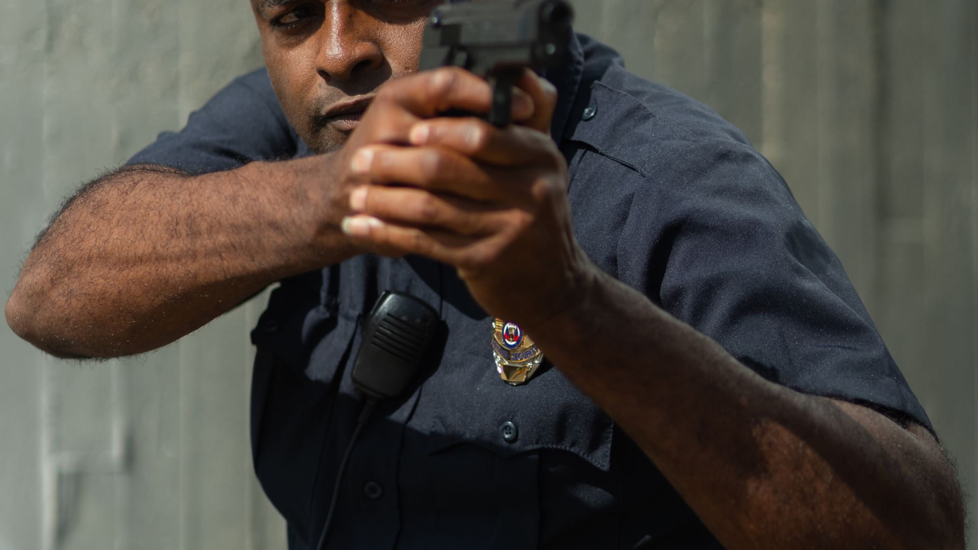 A Policeman Holding a Gun