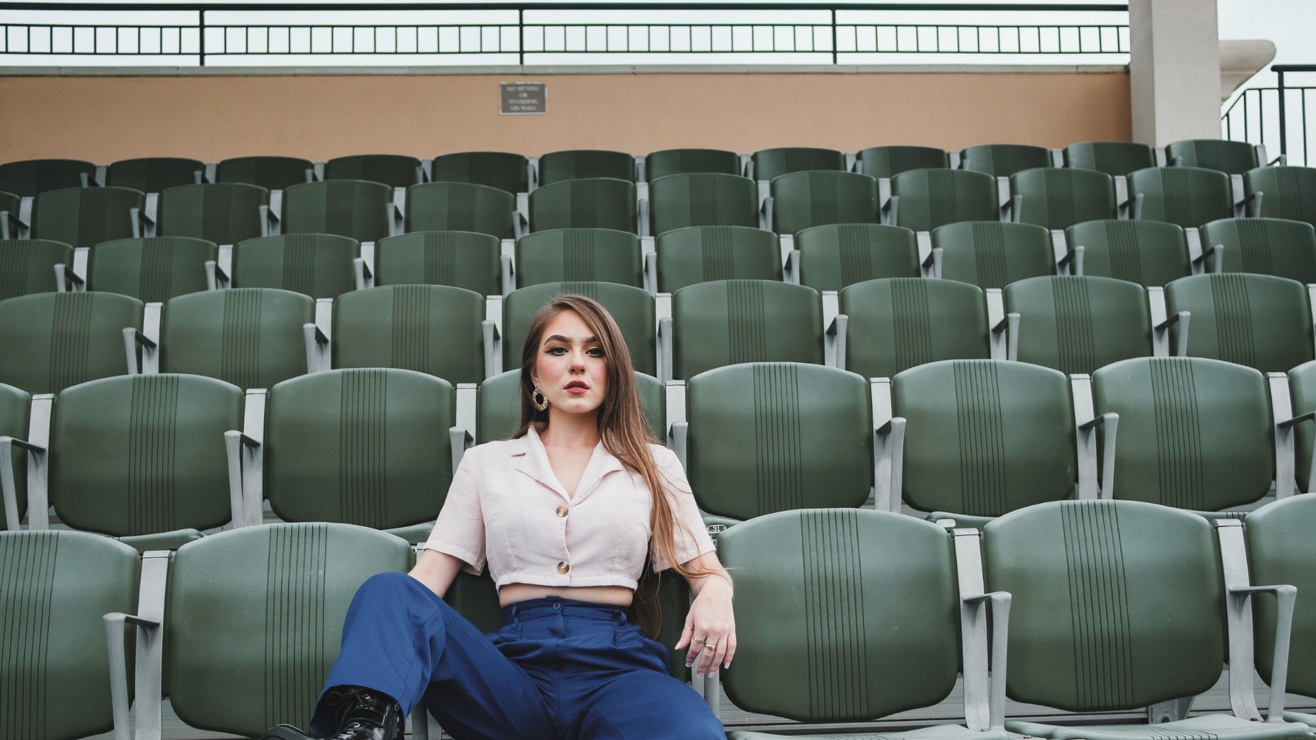 Adult woman sitting on chair outside