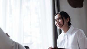 Low Angle Photo of Smiling Social Worker