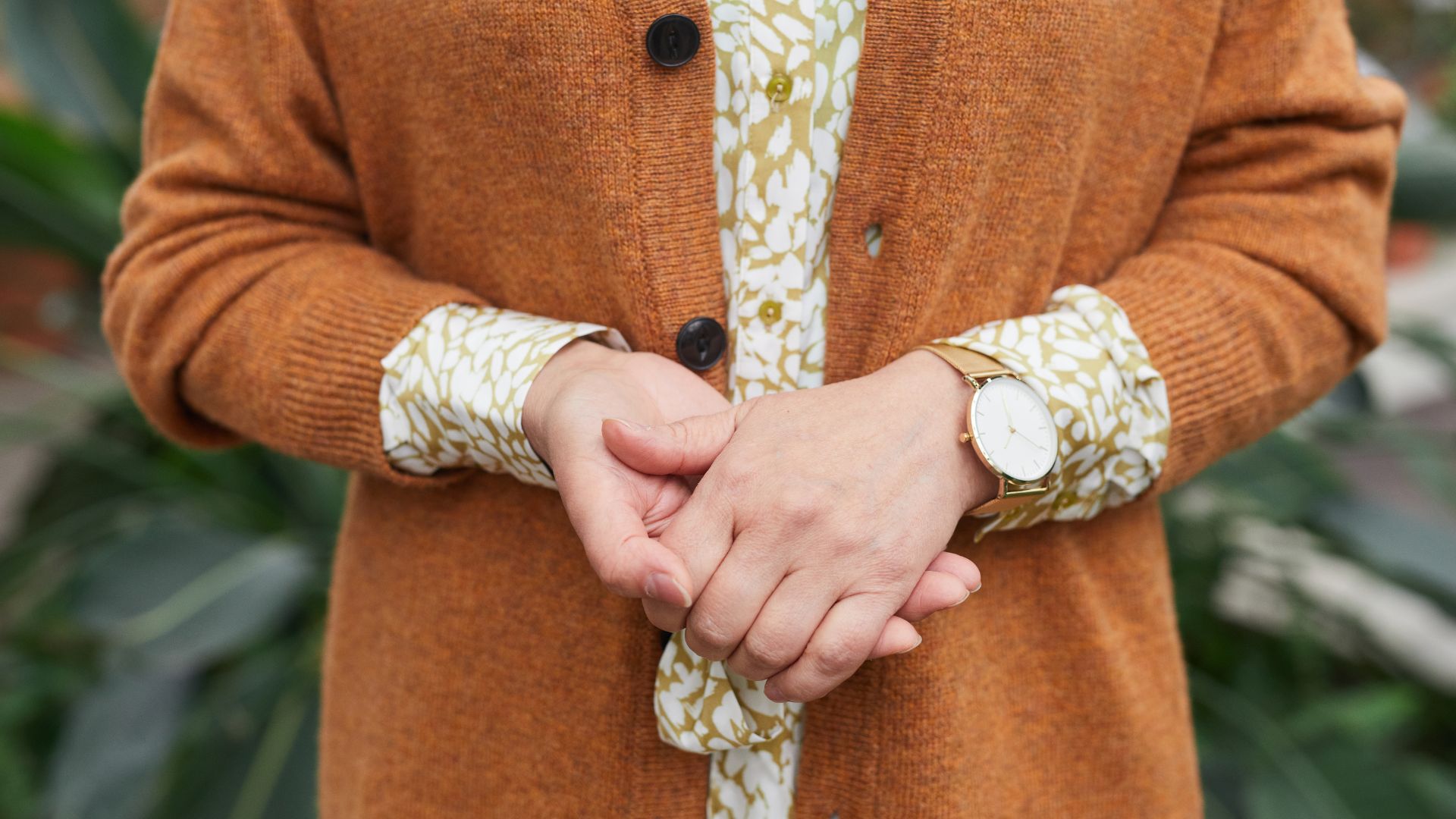 Person Wearing Brown Cardigan