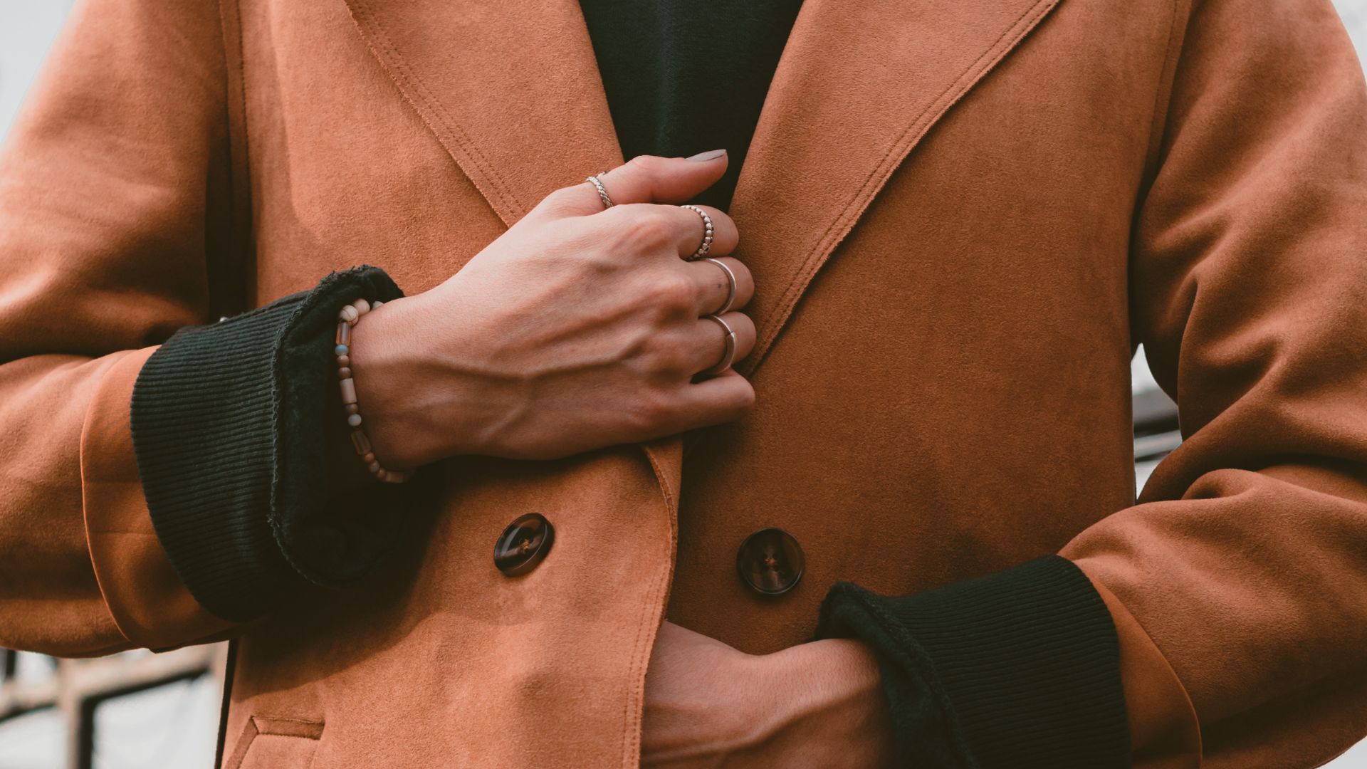 Person in Brown Trench Coat Wearing Black Turtleneck Top