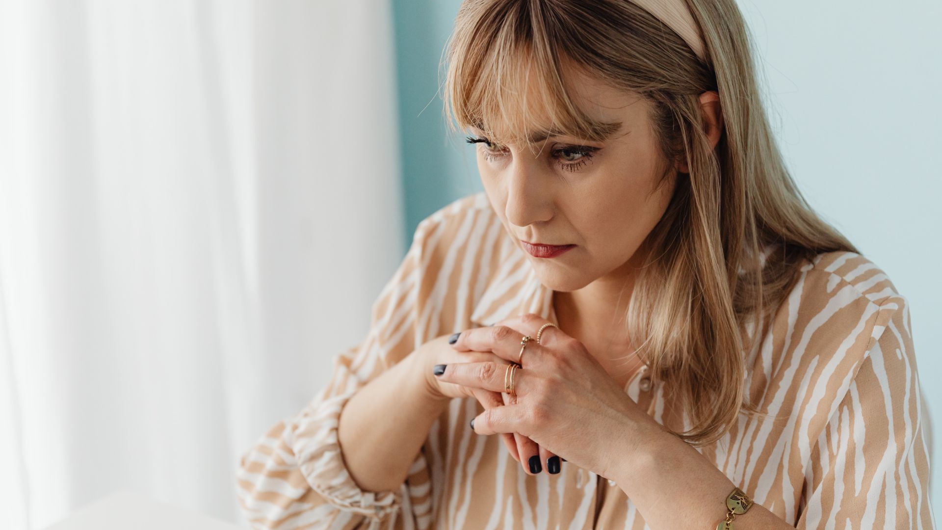 Portrait of a Woman with her Hands Together