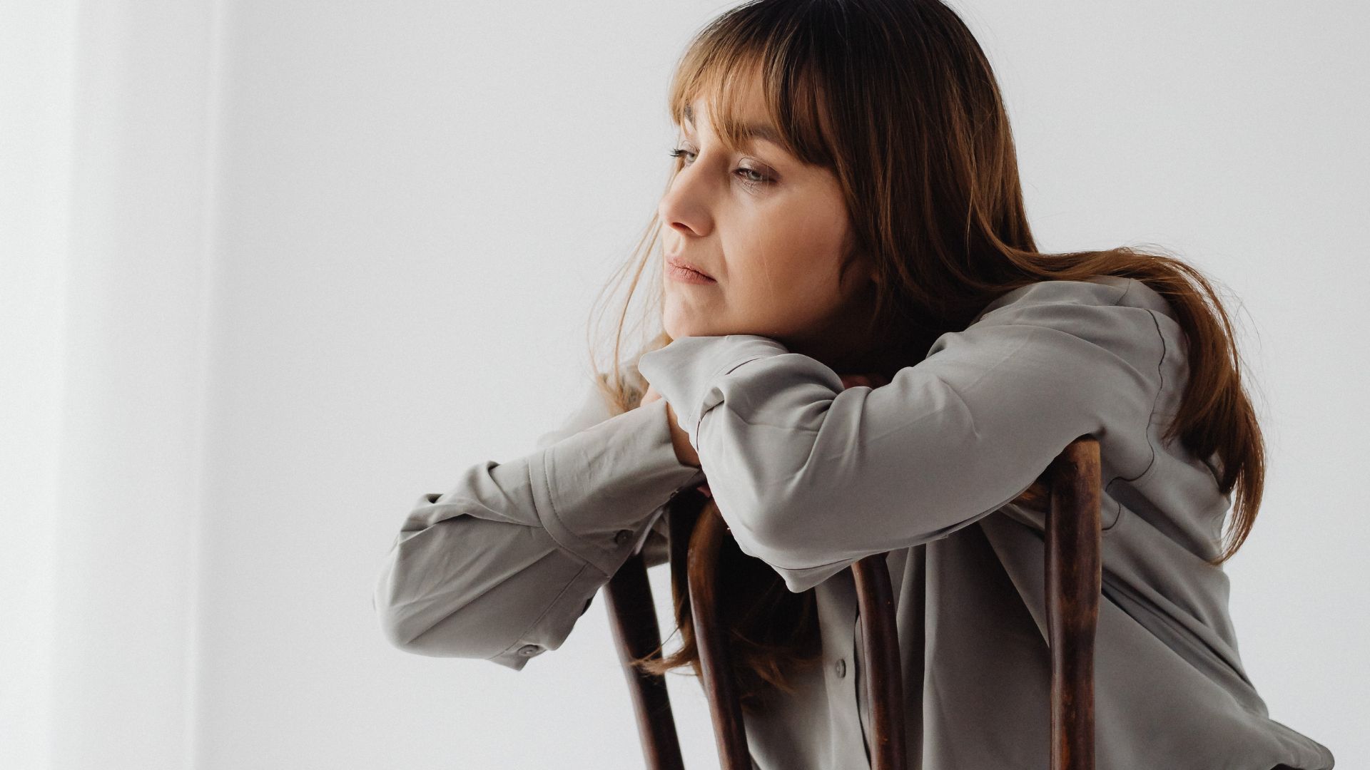 Sad Woman Sitting on a Chair