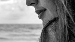 Close-Up Photography of a Woman Near Wall