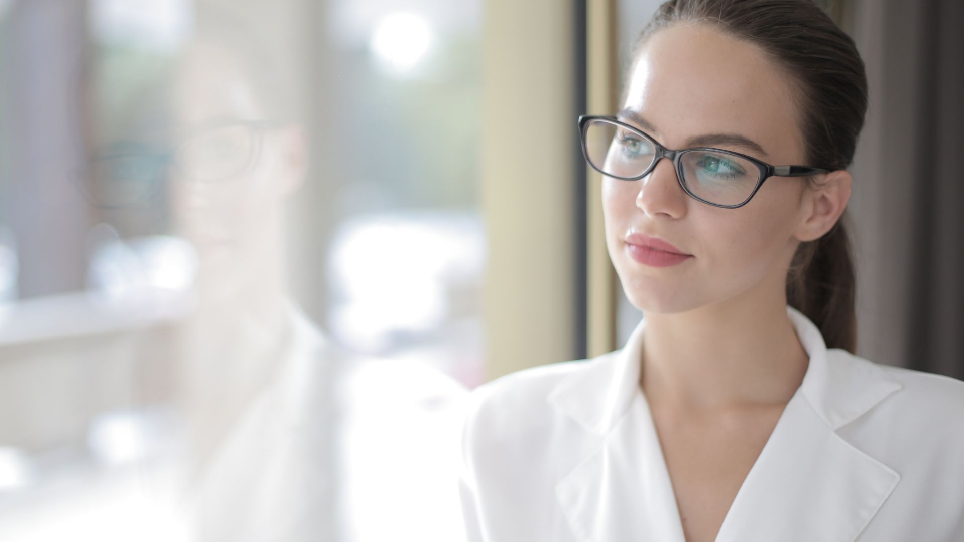 Woman In White Blazer Wearing Black Framed Eyeglasses