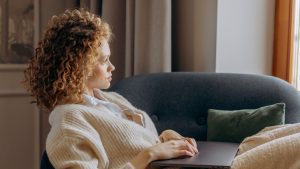 Woman Sitting on Sofa Chair