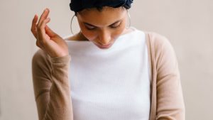 Woman Wearing Blue Turban, White Top and Brown Cardigan