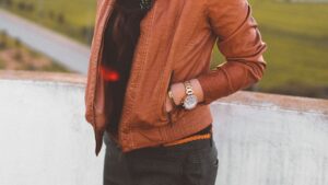 Woman Wearing Brown Leather Jacket and Black Pants