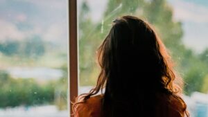 Woman Wearing Brown Shirt Inside Room