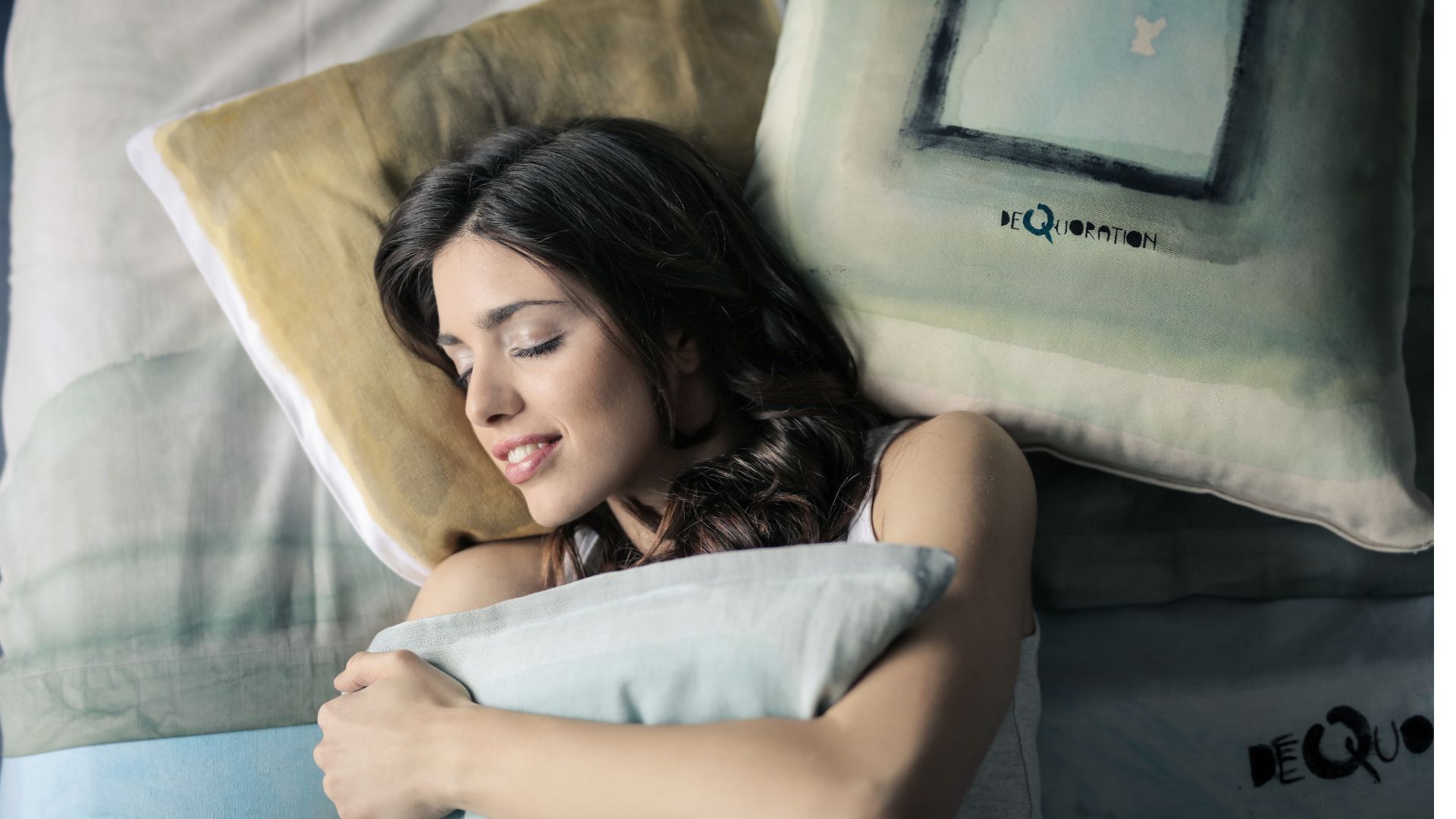 Woman Wearing White Tank-top Sleeping on Gray and White Bedspread