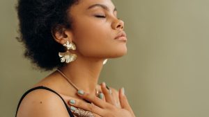 Woman in Black Spaghetti Strap Top Meditating