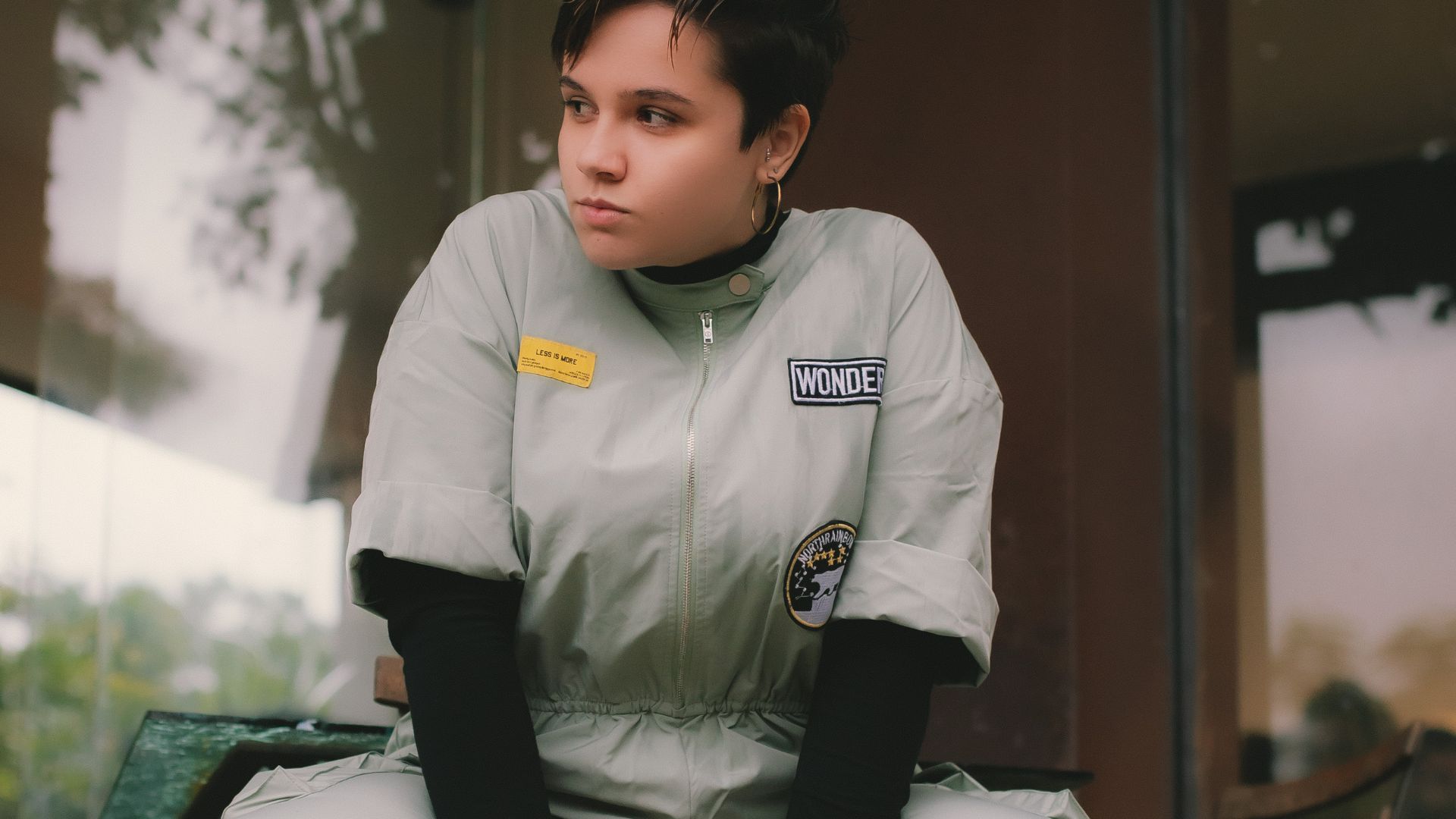 Woman in Uniform Sitting on Chair