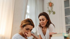 Worried Women Talking at Home